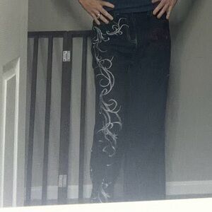 Black and white with red accents Embroidered jeans